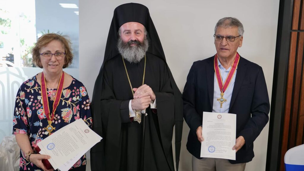 His Eminence, Archbishop Makarios bestowed the Gold Cross of St. Andrew on two foundational workers