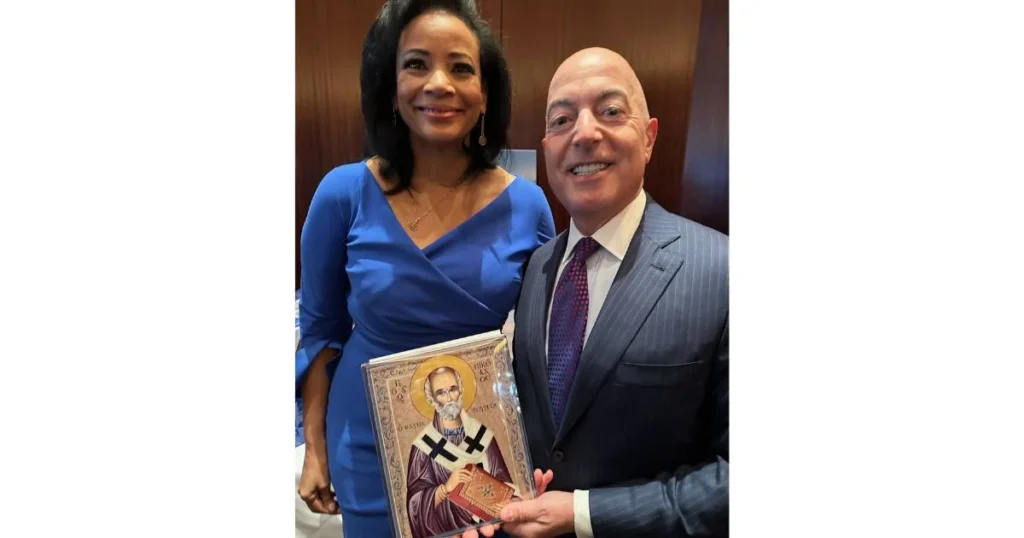 Michael Psaros presents Lauren Green with an icon of St. Nicholas during a recent signing for her book “Light for Today – 365 Daily Devotions from the Lighthouse.”